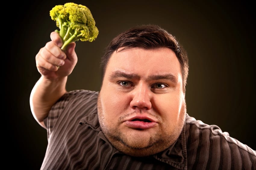 Fat man with broccoli