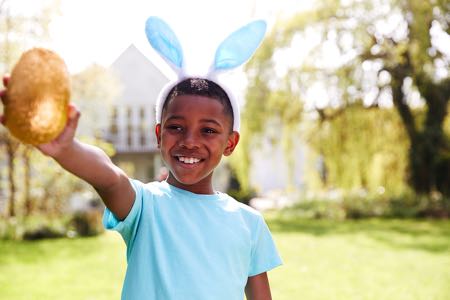 Boy finding golden Easter egg