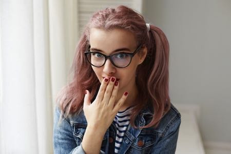 Portrait of woman with painted nails