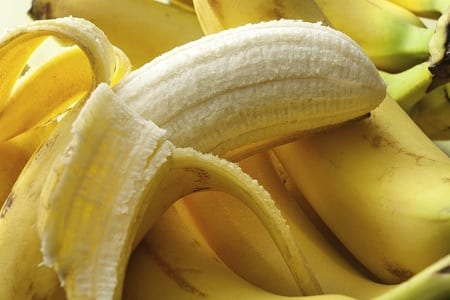 Half unpeeled banana