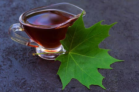 Maple syrup with maple tree leaf