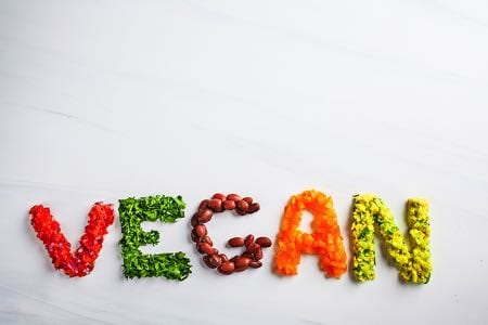 Vegan spelled out in food