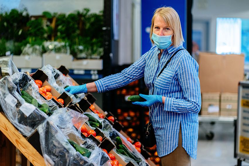 Lady shopping for fruit during pandemic