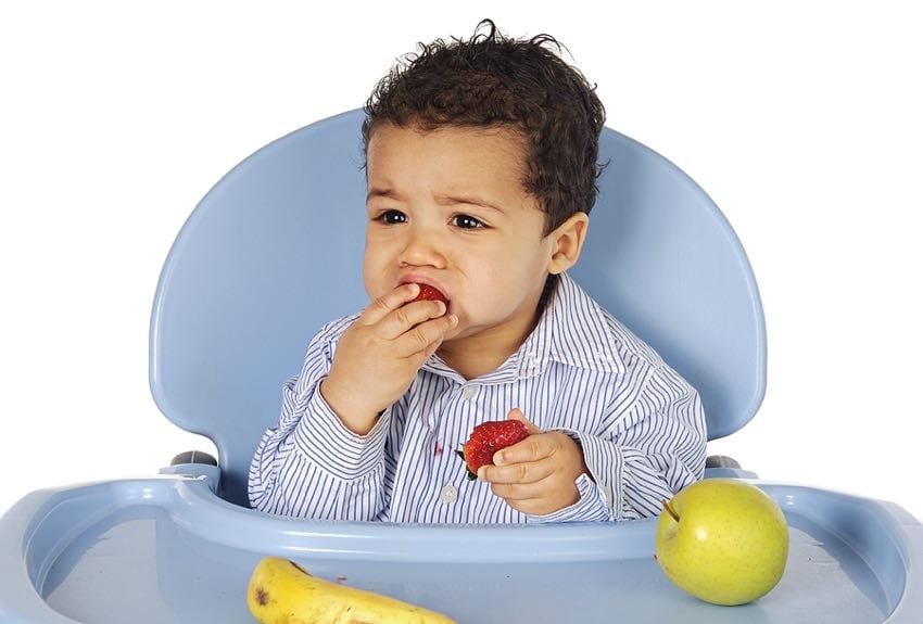 Older baby eating fruits